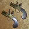 ﻿Fine Pair of Brass Frame Over and Under Tap Action Flintlock Pistols, ca. 1800